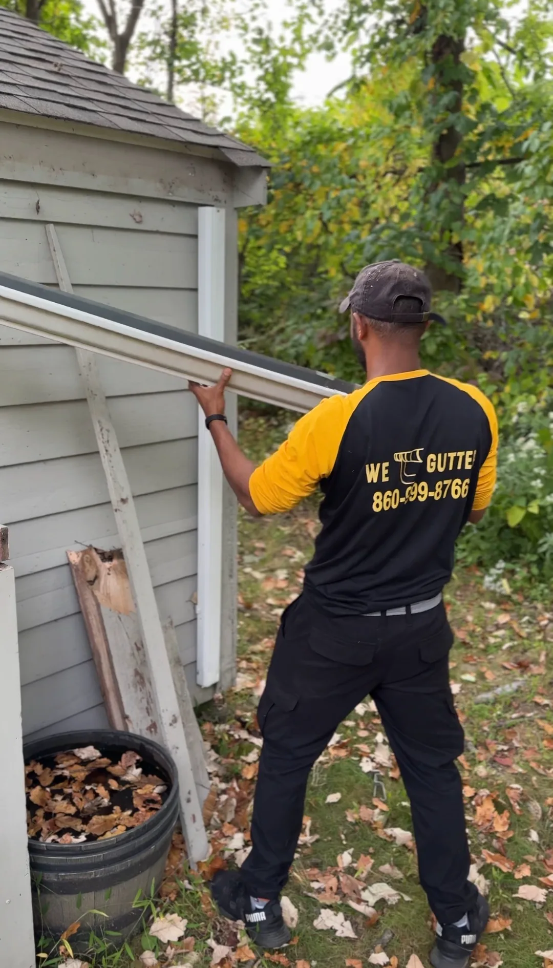 We Gutter technician repairing aluminum gutter on a Connecticut home — professional gutter repair in Waterbury CT