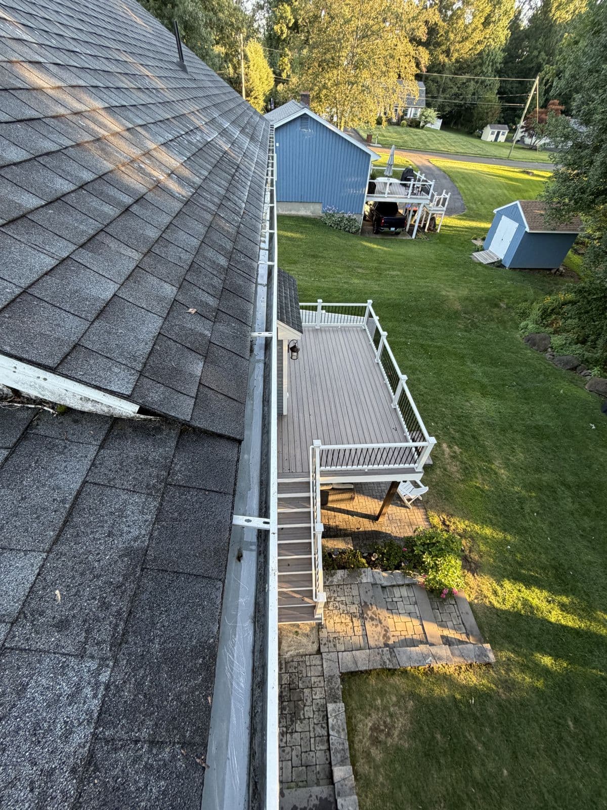 Southington: The same gutter run after visible debris removal.