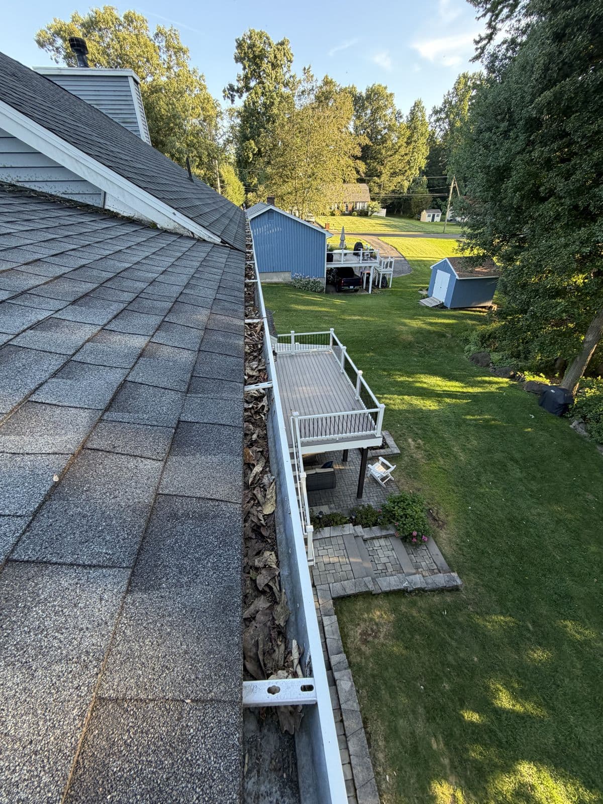 Southington: Accumulated leaves along the rear-deck gutter.